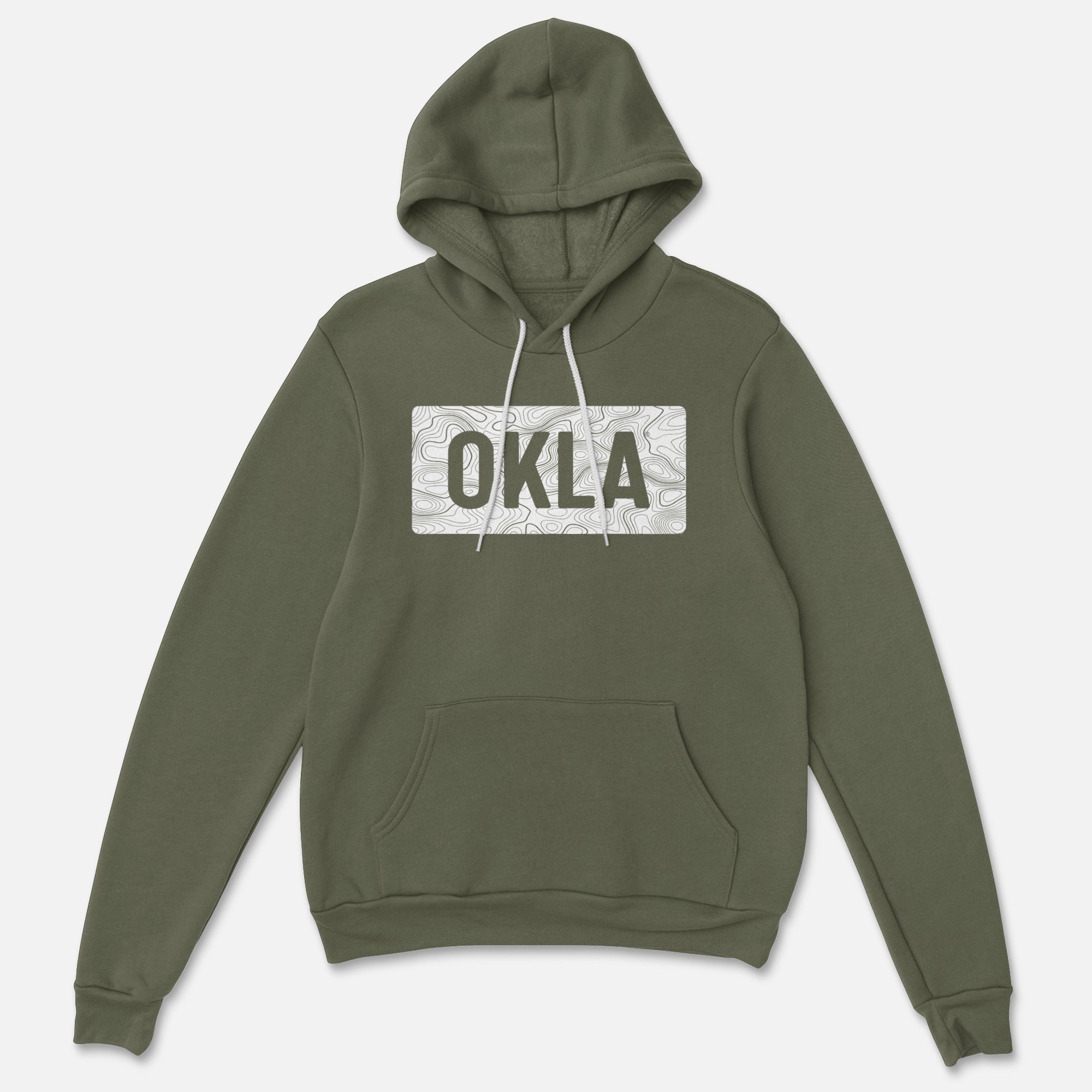 The OKLA Navigator BOLD Hoodie is a recycled cotton green sweatshirt that merges adventure with comfort. It includes a front pocket and boasts a gray rectangular patch emblazoned with bold "OKLA" letters, encircled by an understated white design. The hoodie also features white drawstrings for a polished finish.