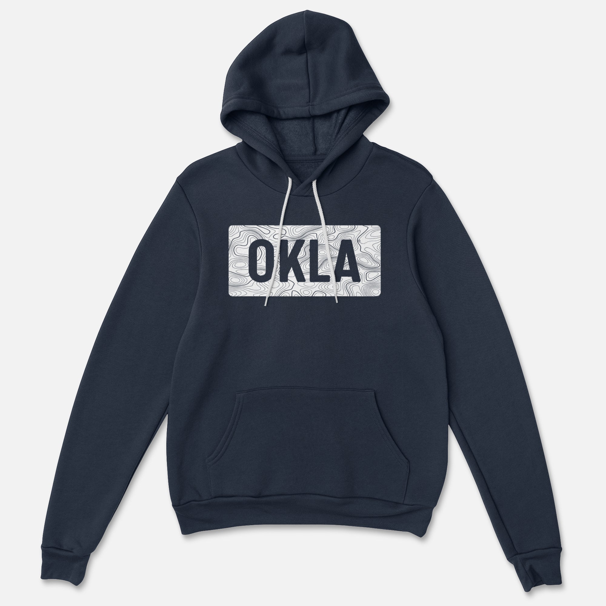 The OKLA Navigator BOLD Hoodie offers both adventure and comfort, featuring a dark blue fabric, a front pocket, and white drawstrings. Made from recycled cotton, it highlights a chest design with a subtle pattern and prominently displays the text OKLA in bold black letters.