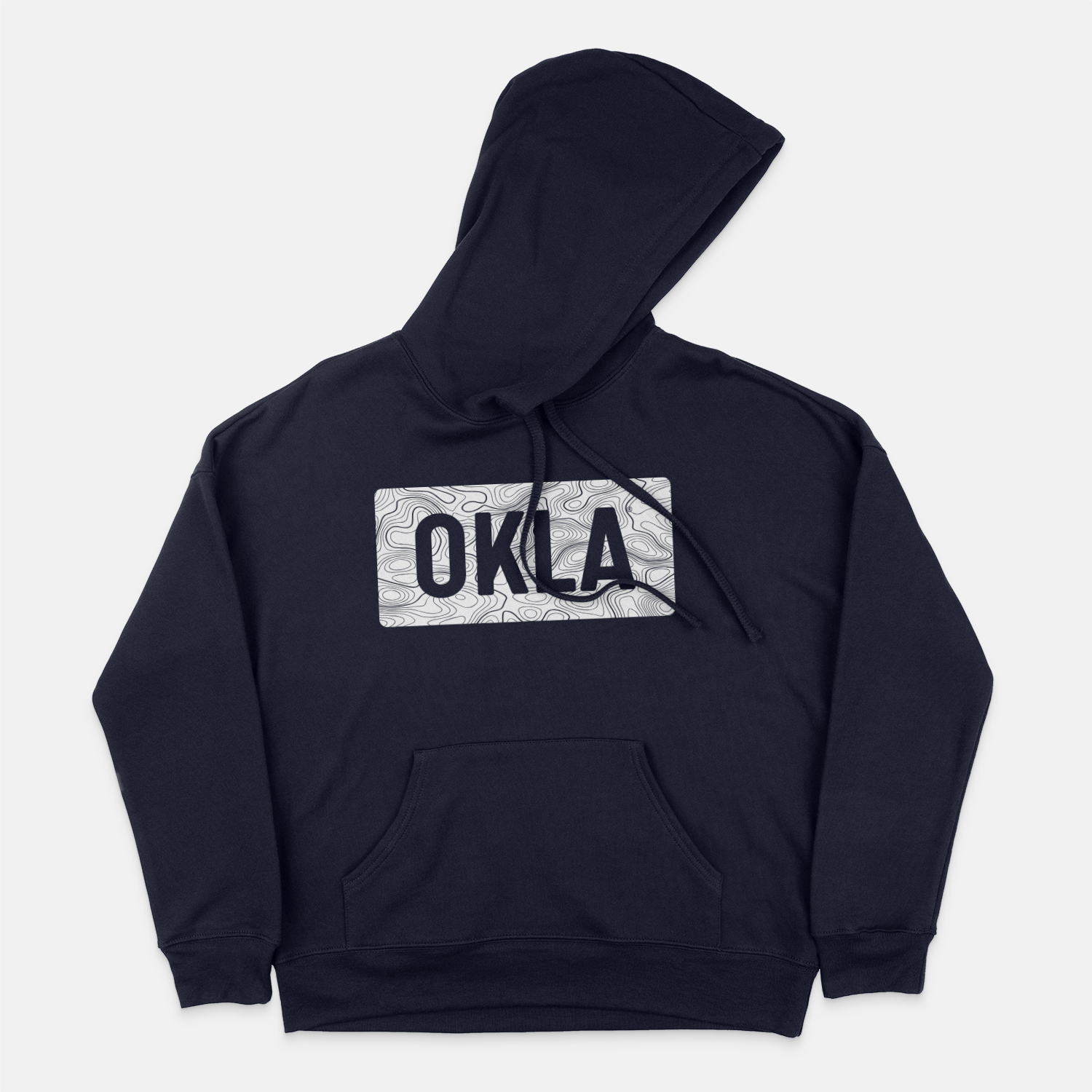 The OKLA Navigator BOLD Hoodie is a navy hoodie crafted from recycled cotton. It showcases a patterned rectangular design on the chest with the letters OKLA, offering a comfortable unisex fit. The hoodie features a front pocket and an adjustable drawstring hood for added convenience.