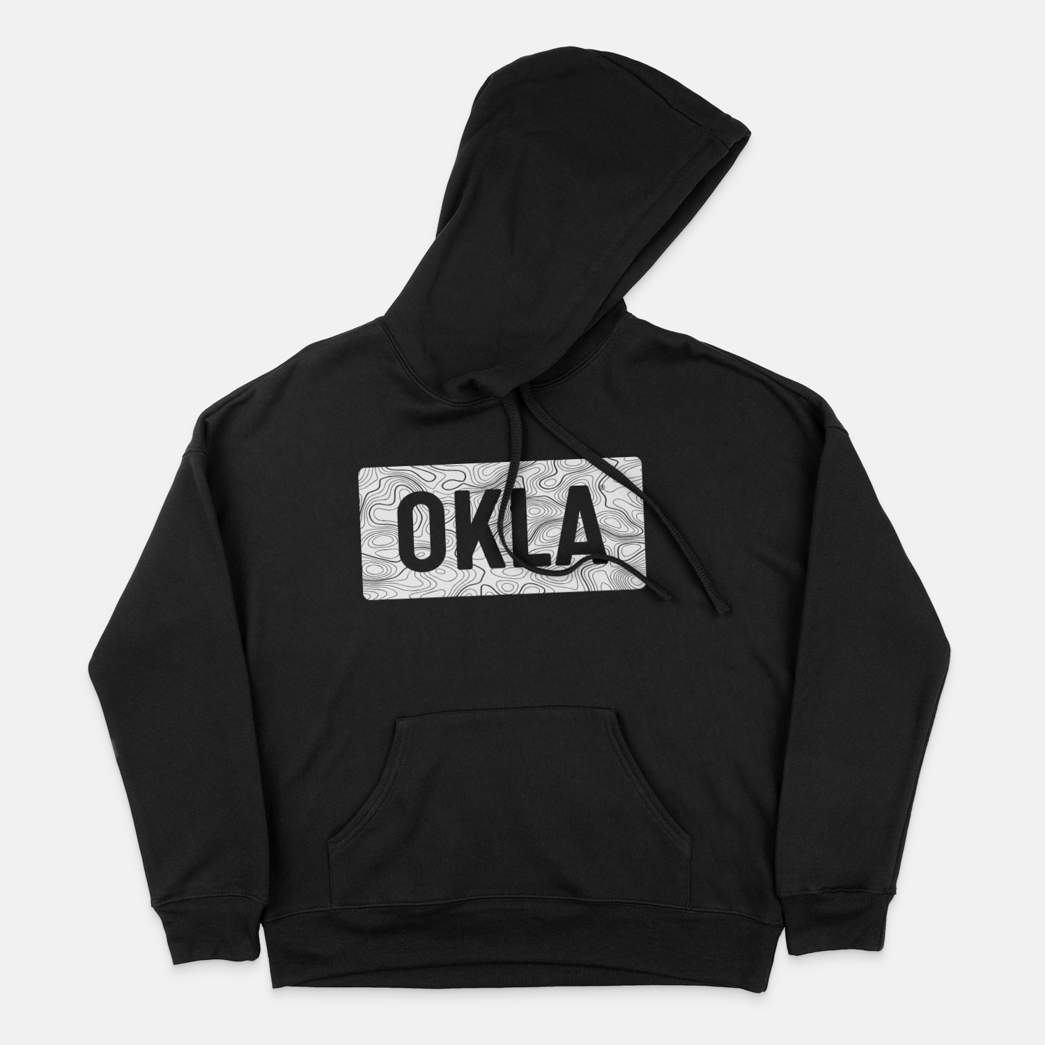 The OKLA Navigator BOLD Hoodie, made from recycled cotton for a comfortable unisex fit, is presented in black with a front pocket. The design includes intricate swirls and bold black letters spelling "OKLA" in a rectangular format. The hood is shown laid flat on a white background.