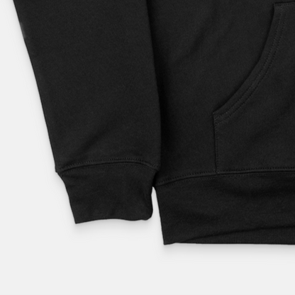 A close-up view of the OKLA Navigator BOLD Hoodie highlights its comfortable unisex fit, crafted from recycled cotton. The image features the side pocket and a portion of the sleeve set against a pristine white background.