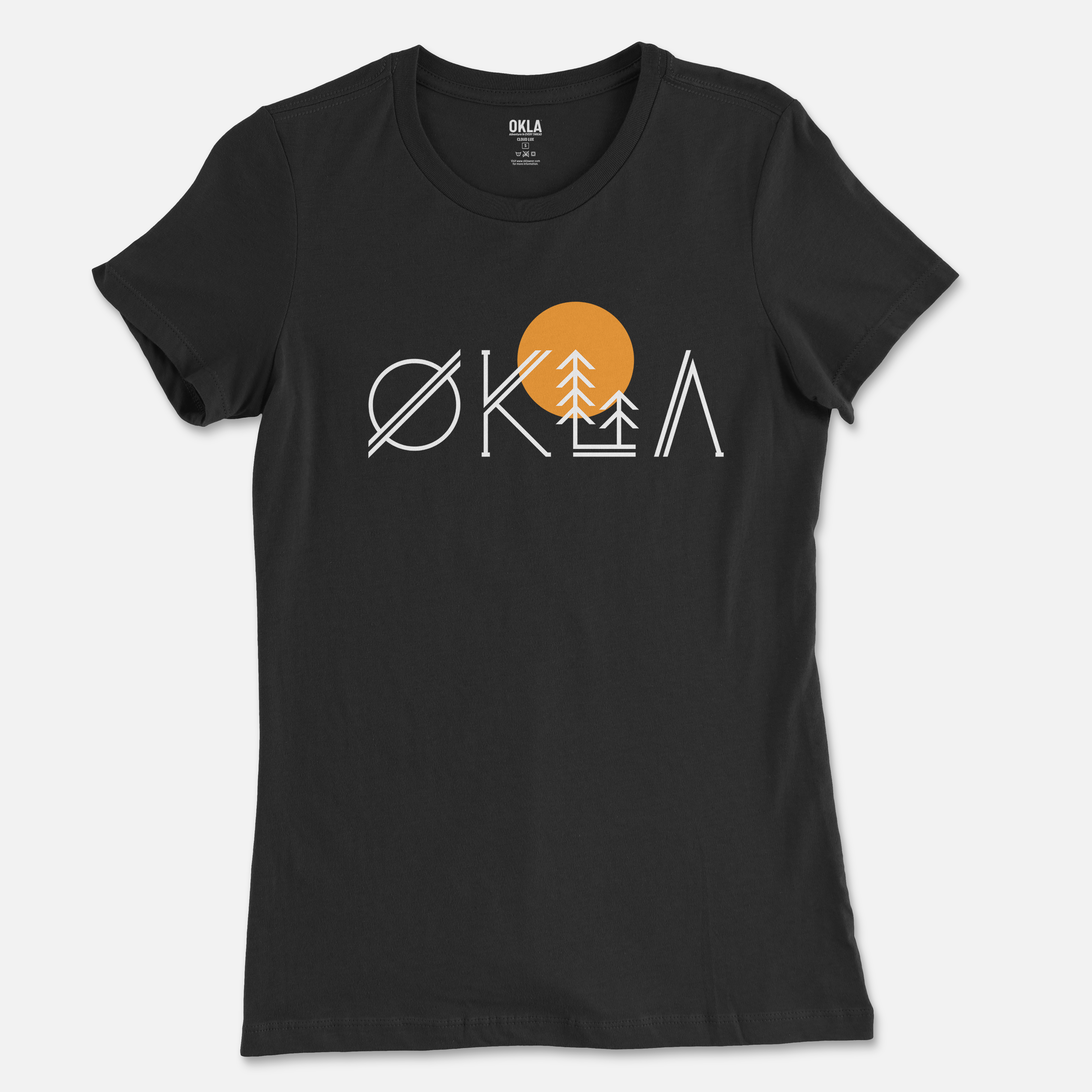 Introducing the OKLA Native Tee, a black T-shirt made from recycled cotton. This tee showcases an eye-catching graphic design with white letters spelling "OKLA," complemented by elements like trees and a vibrant orange sun. Available in unisex sizing, it's ideal for those who appreciate both fashion and eco-friendliness.