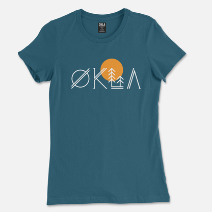 The OKLA Native Tee in blue showcases a stylized design spelling "OKLA" with geometric shapes, where the 'O' resembles the Scandinavian letter Ø. The 'K' is beautifully crafted with a sun and tree motif, featuring a vibrant orange circle representing the sun. Made from recycled cotton, it's perfect for your next adventure.