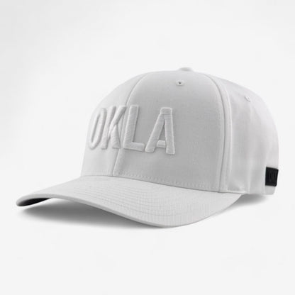 Introducing the OKLA Original White Embroidered hat, a fashionable cap that showcases 'OKLA' in bold letters on the front. Designed with an athletic shape and a curved brim, this stylish hat also features a black tag on the side and an elastic stretch band for enhanced comfort.