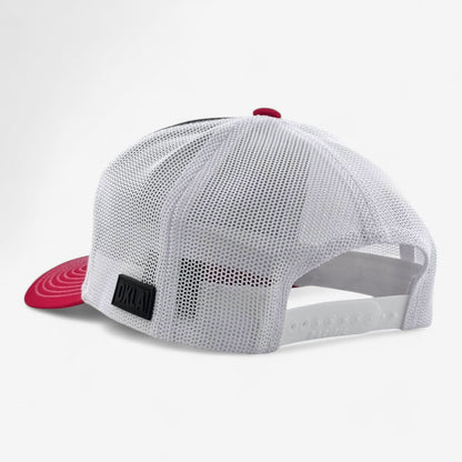 The OKLA Freedom Trucker Hat is a white mesh baseball cap with a red brim and sweat-wicking technology. From the back view, it showcases an adjustable snap closure and features a vintage-inspired 3D patch on one side.