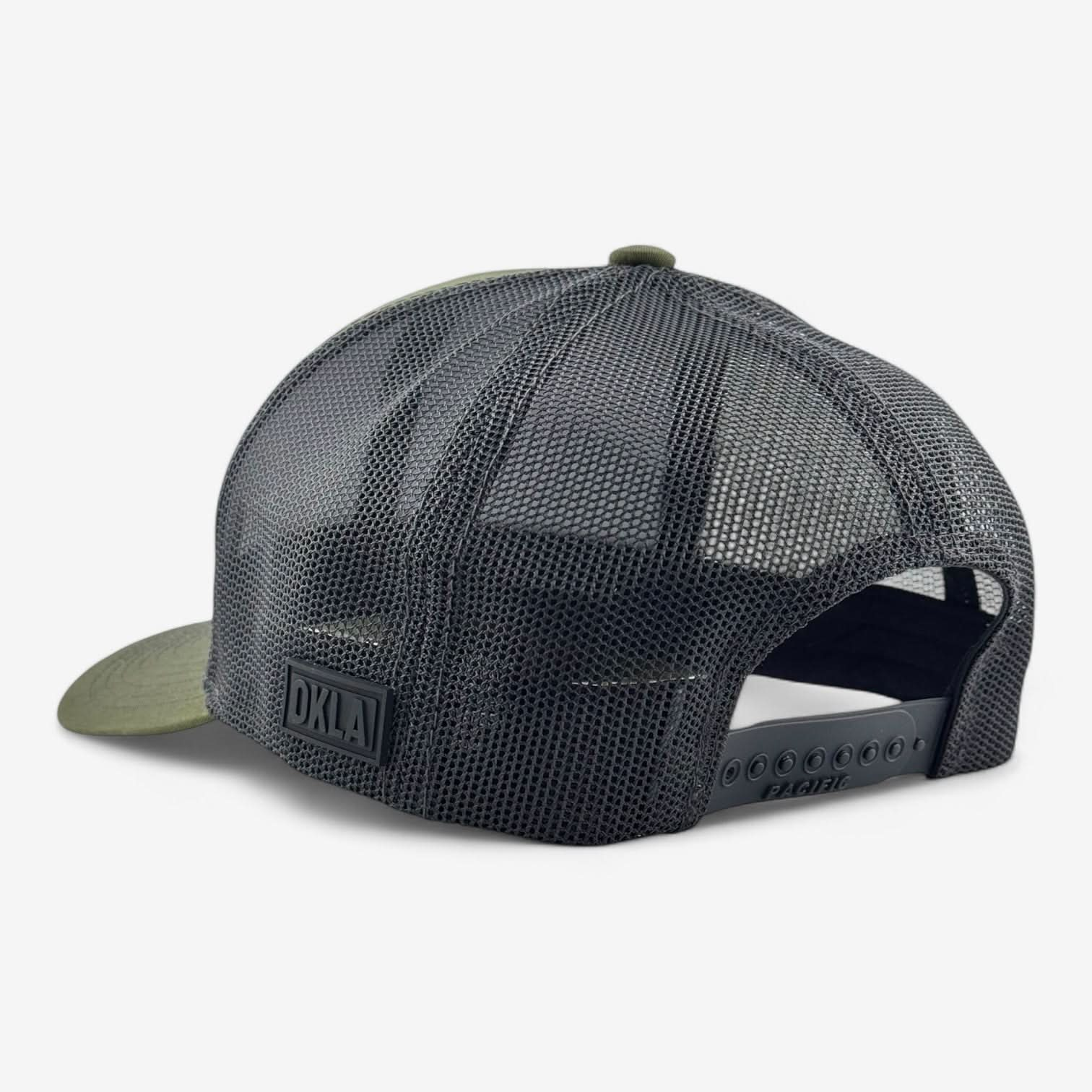 The back view of a black mesh baseball cap with an adjustable snapback closure is shown. It includes a vintage-style 3D patch displaying the letters DKLA, similar to the OKLA Freedom Trucker Hat.