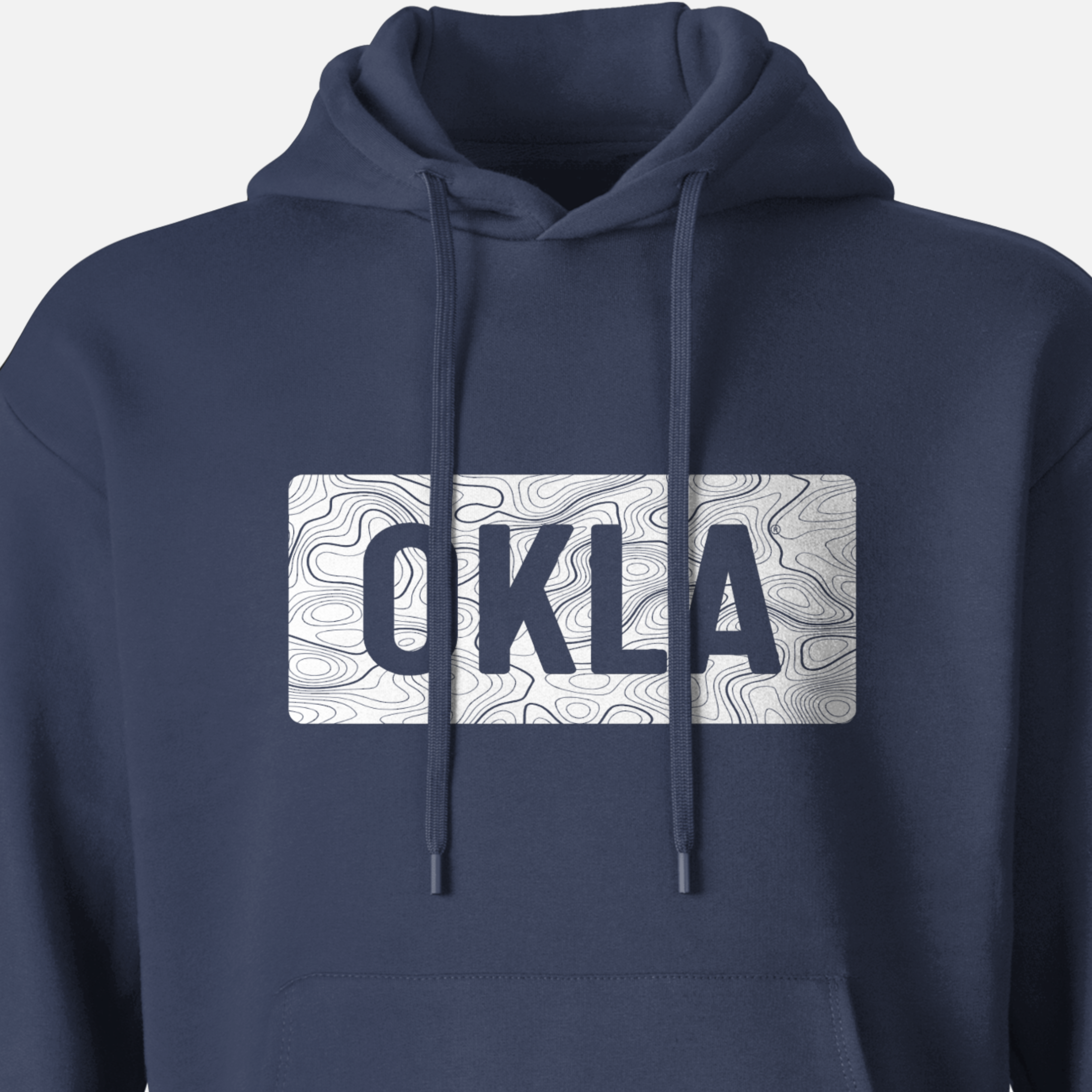 Experience the thrill of adventure with the OKLA Navigator BOLD Hoodie, made from recycled cotton. This navy blue hoodie features a bold graphic displaying the letters OKLA against a white background, enhanced by a subtle map contour design.